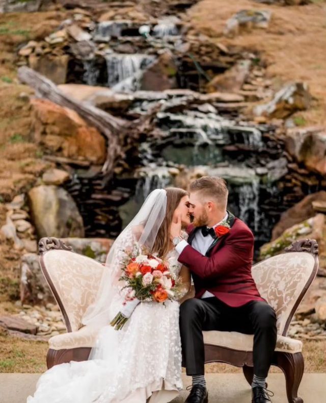A sweet kiss by the waterfall